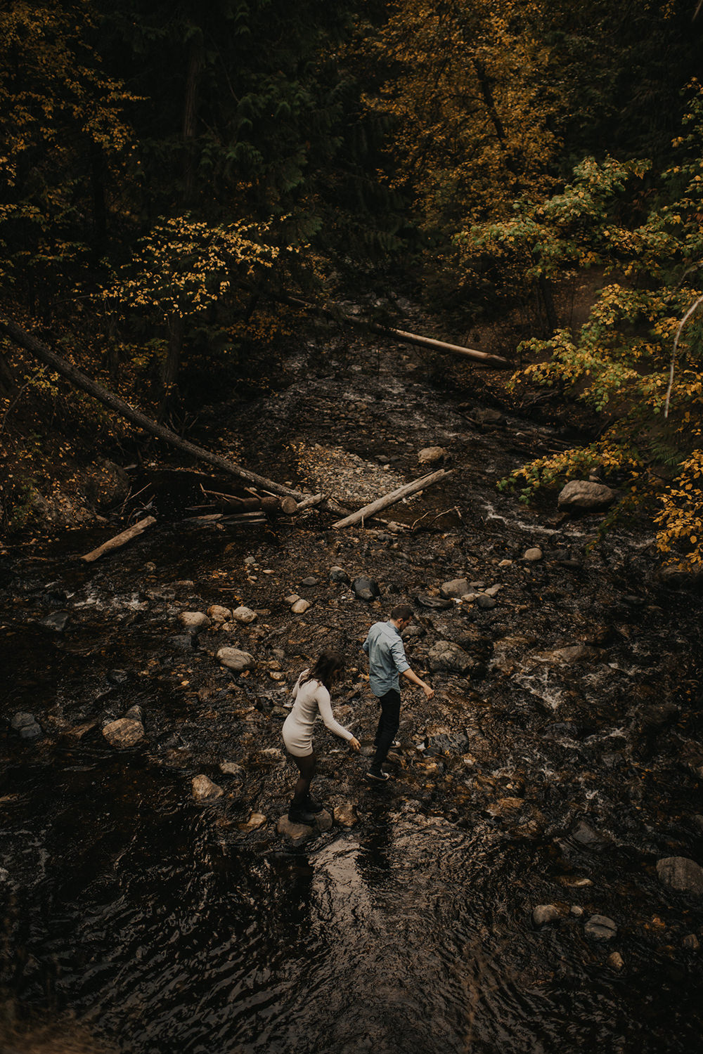 Adventurous fall couple exploring during engagement session