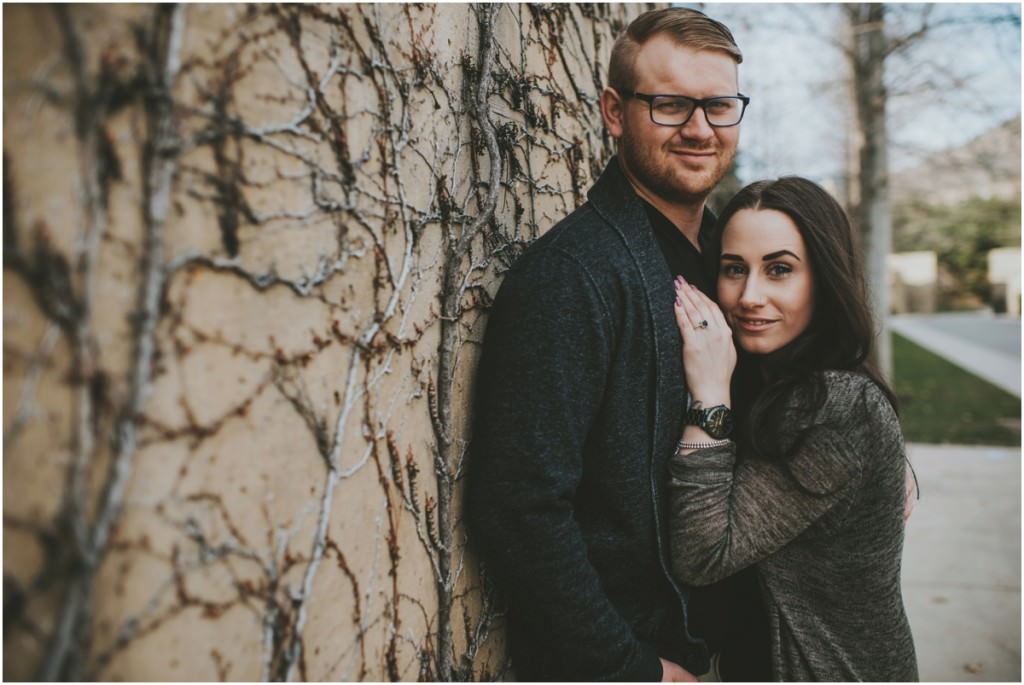 Wall filled with vines for engagement photo