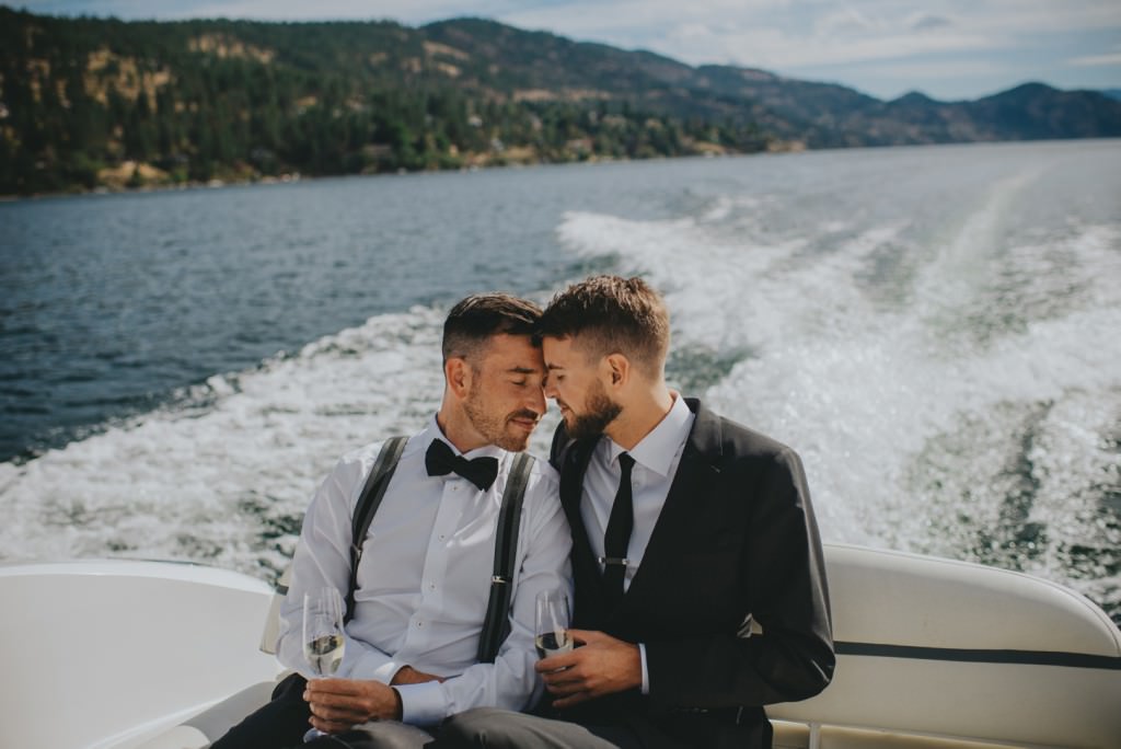 Same Sex couple in boat on wedding