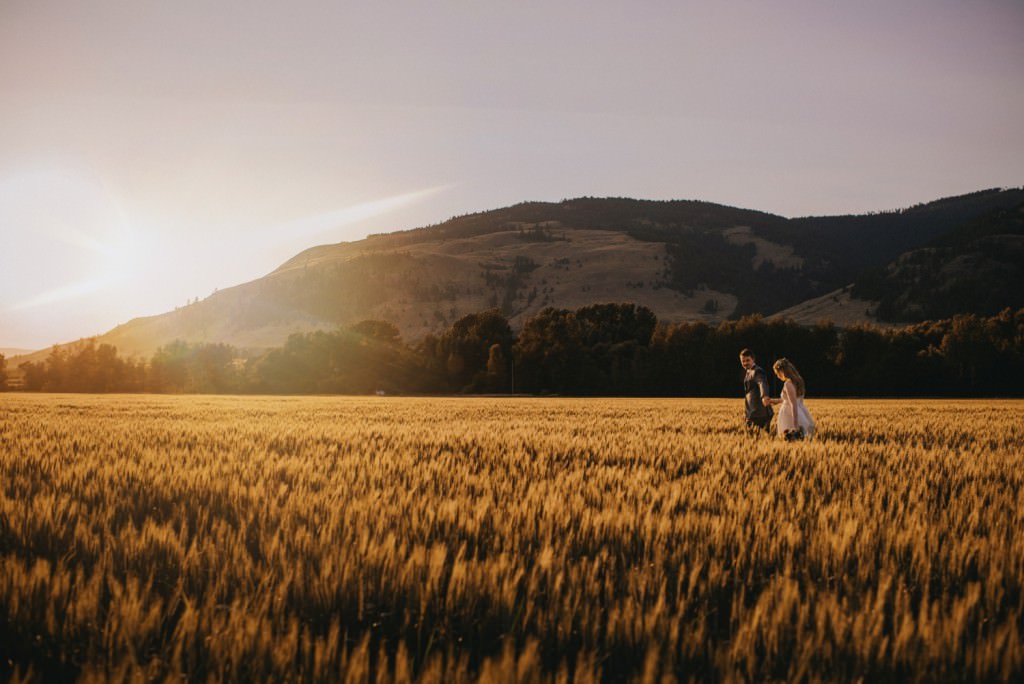 Stunning sunset in wheat field at wedding