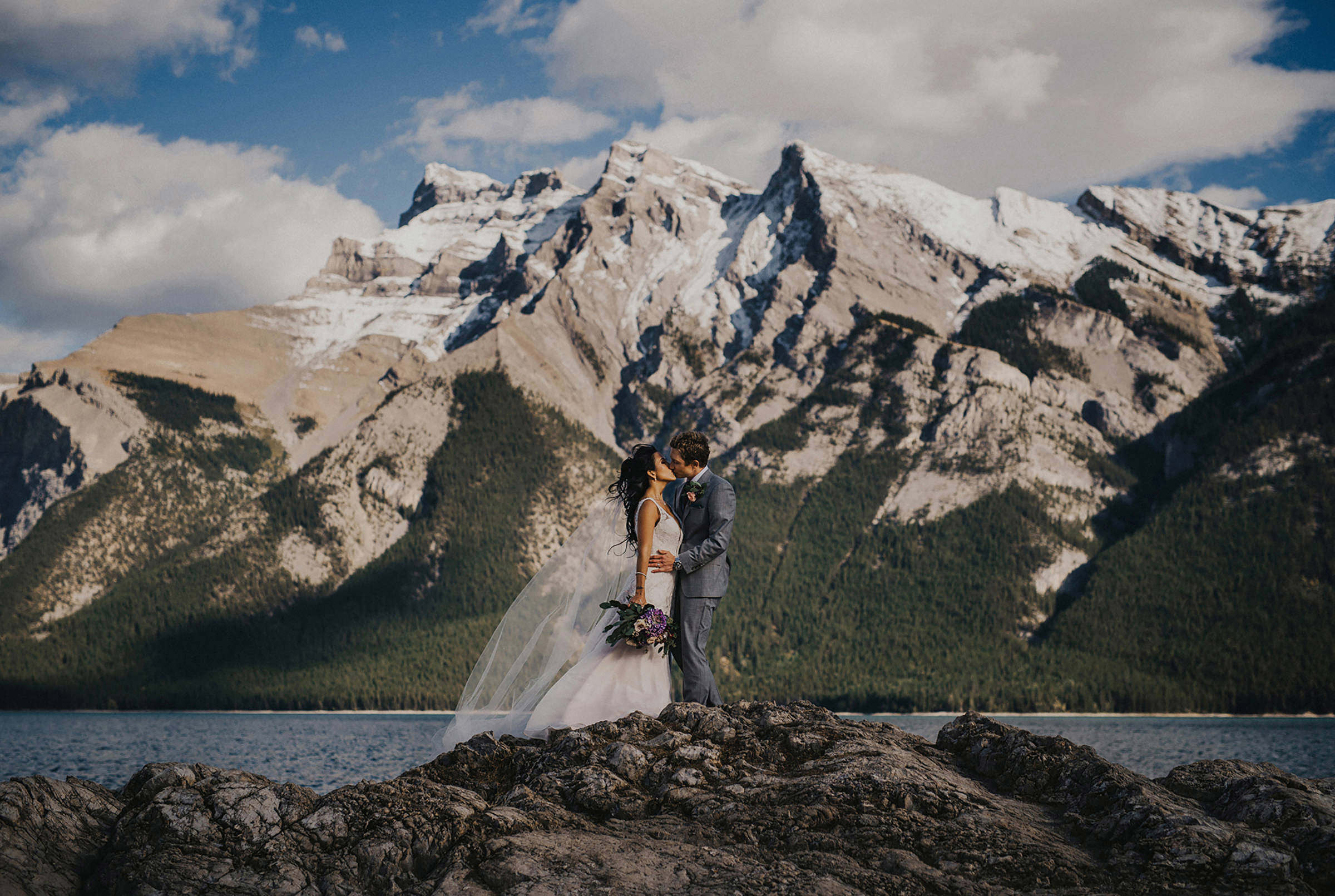 Bride and groom in the rocky mountains